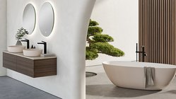 Ein Badezimmer mit einer Freistehenden Badewanne und einem Baum